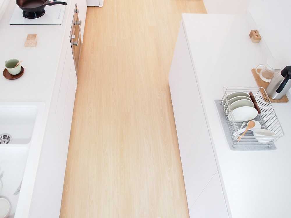 Scandinavian Kitchen with Wood Flooring and Kitchen Tap