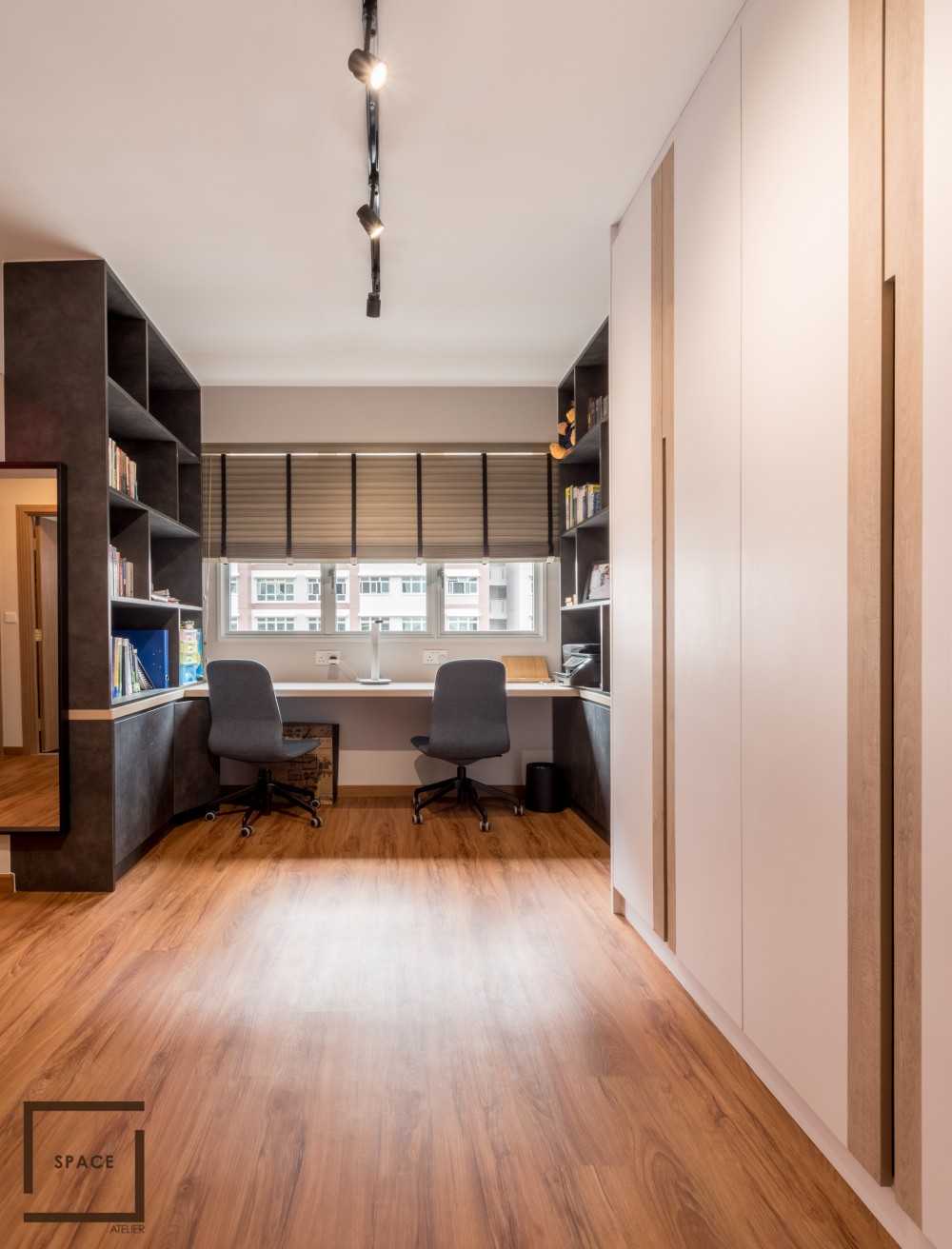 Minimalist Home Office with Bookshelf and Desk