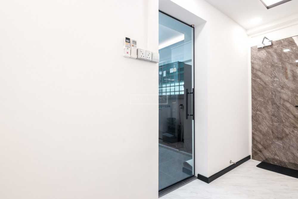 Contemporary Entryway with Glass Door and Shoe Cabinets