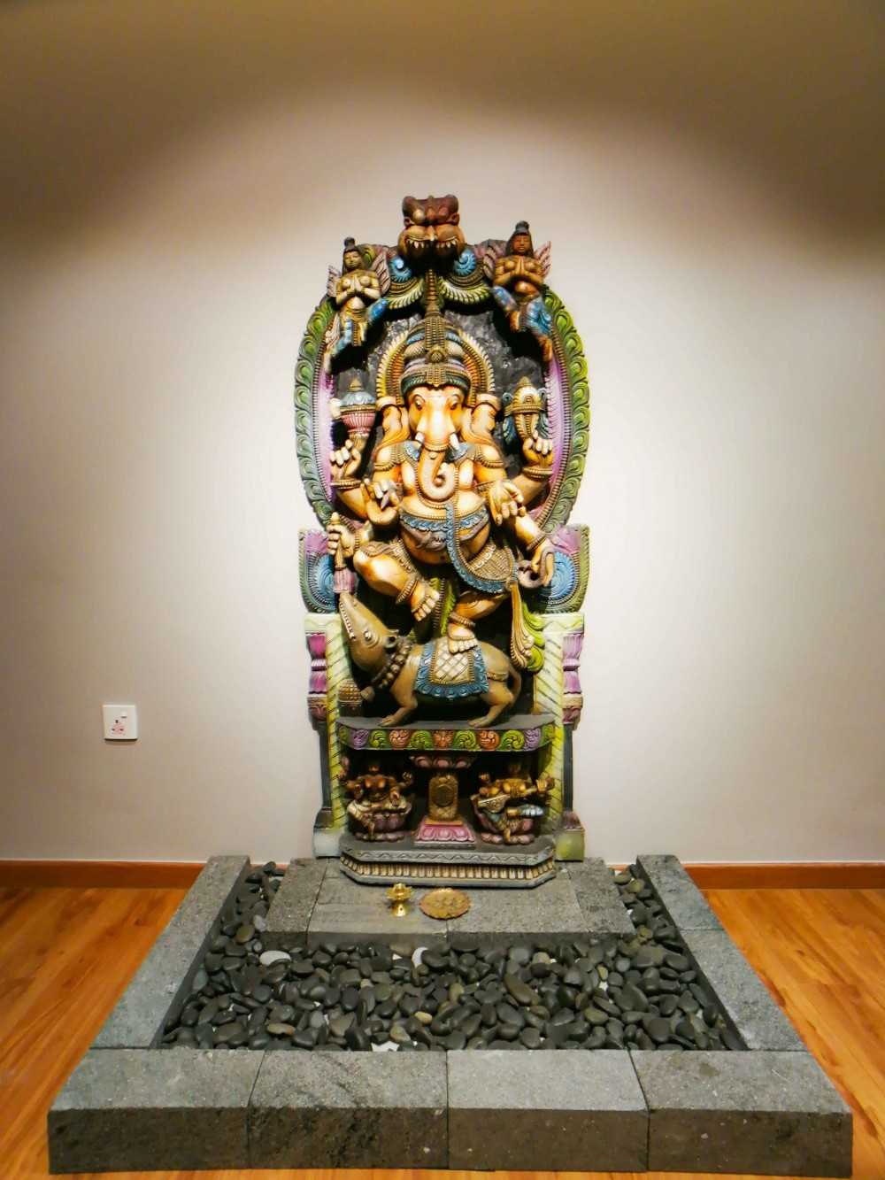 Transitional Entryway with Drop Light and Altar