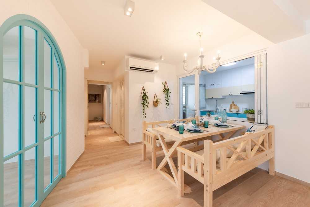 Transitional Dining Room with Chandelier and Dining Table