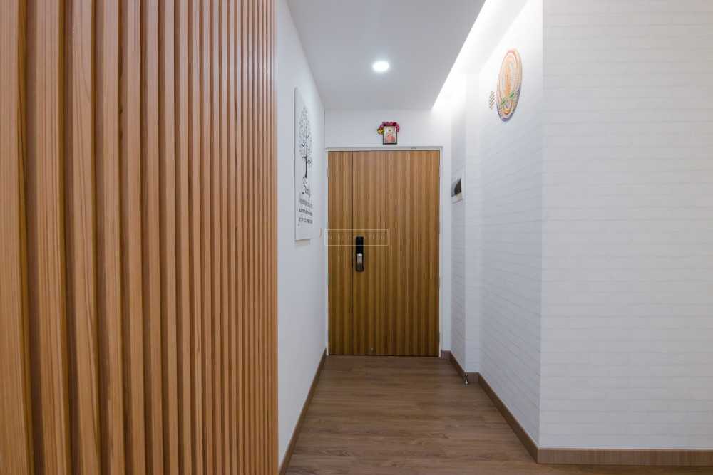 Scandinavian Entryway with Vinyl Flooring and Feature Wall