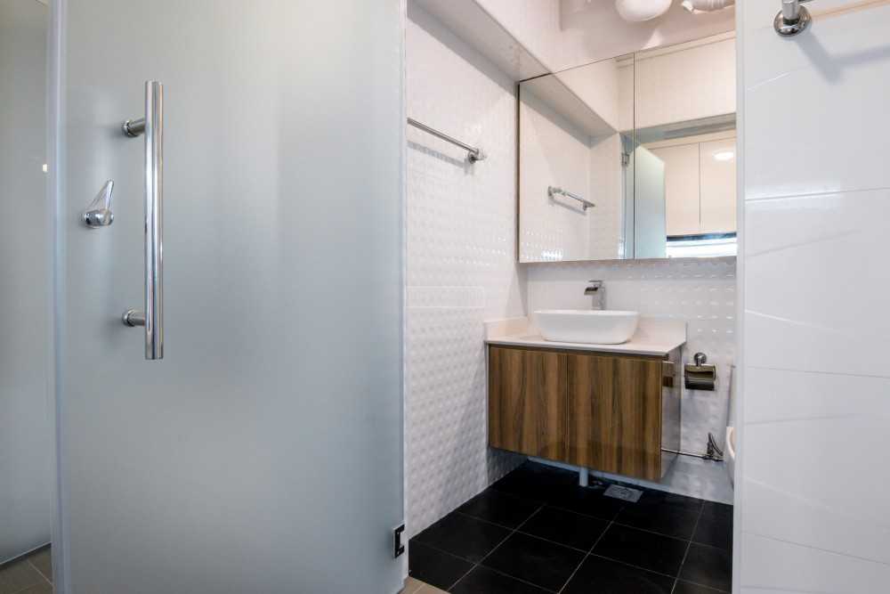 Scandinavian Bathroom with Homogeneous Tiles and Mirror