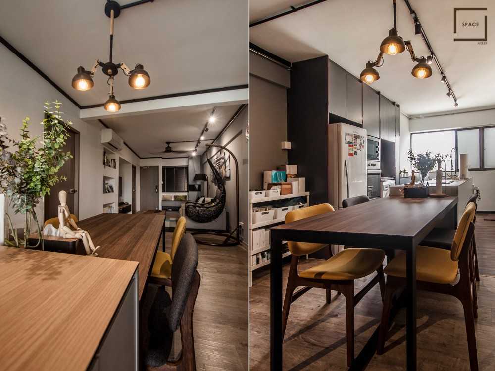 Industrial Dining Room with Drop Light and Dining Table