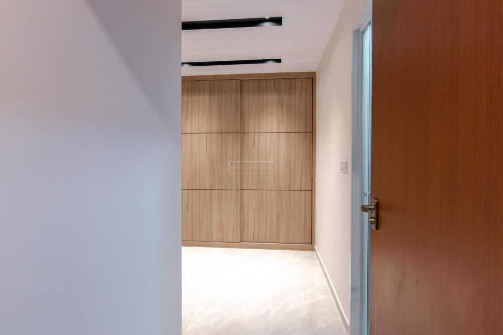 Scandinavian Bedroom with Homogeneous Tiles and Ceiling Light