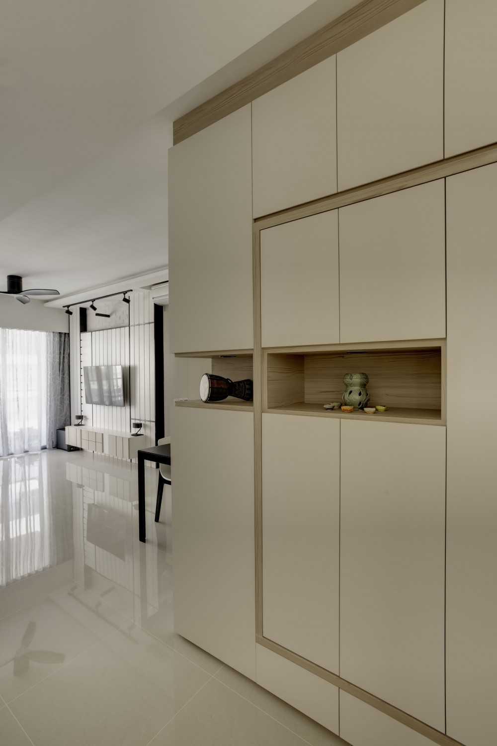 Scandinavian Entryway with Homogeneous Tiles and Shoe Cabinets