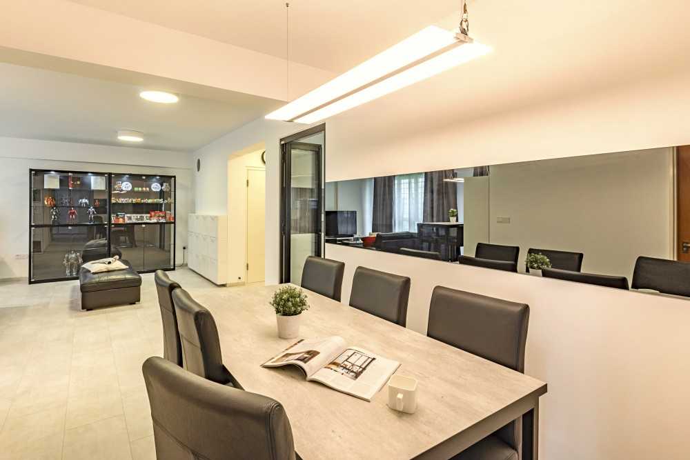 Contemporary Dining Room with Mirror and Ceiling Light