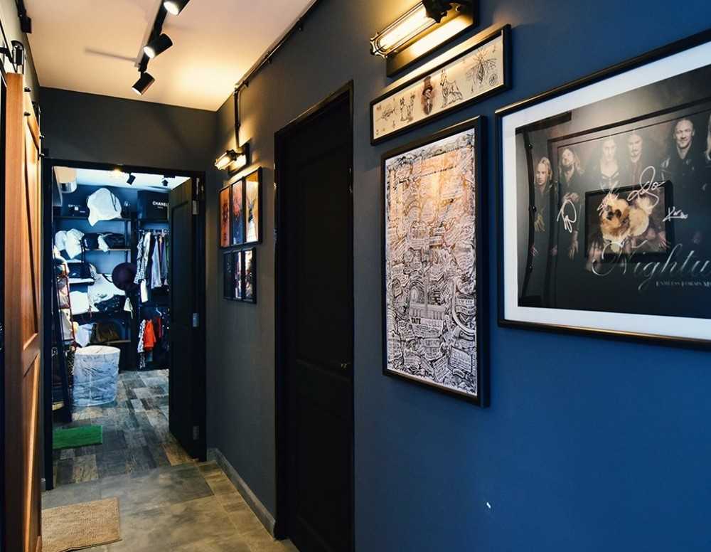 Transitional Hallway with Bookshelf and Artwork