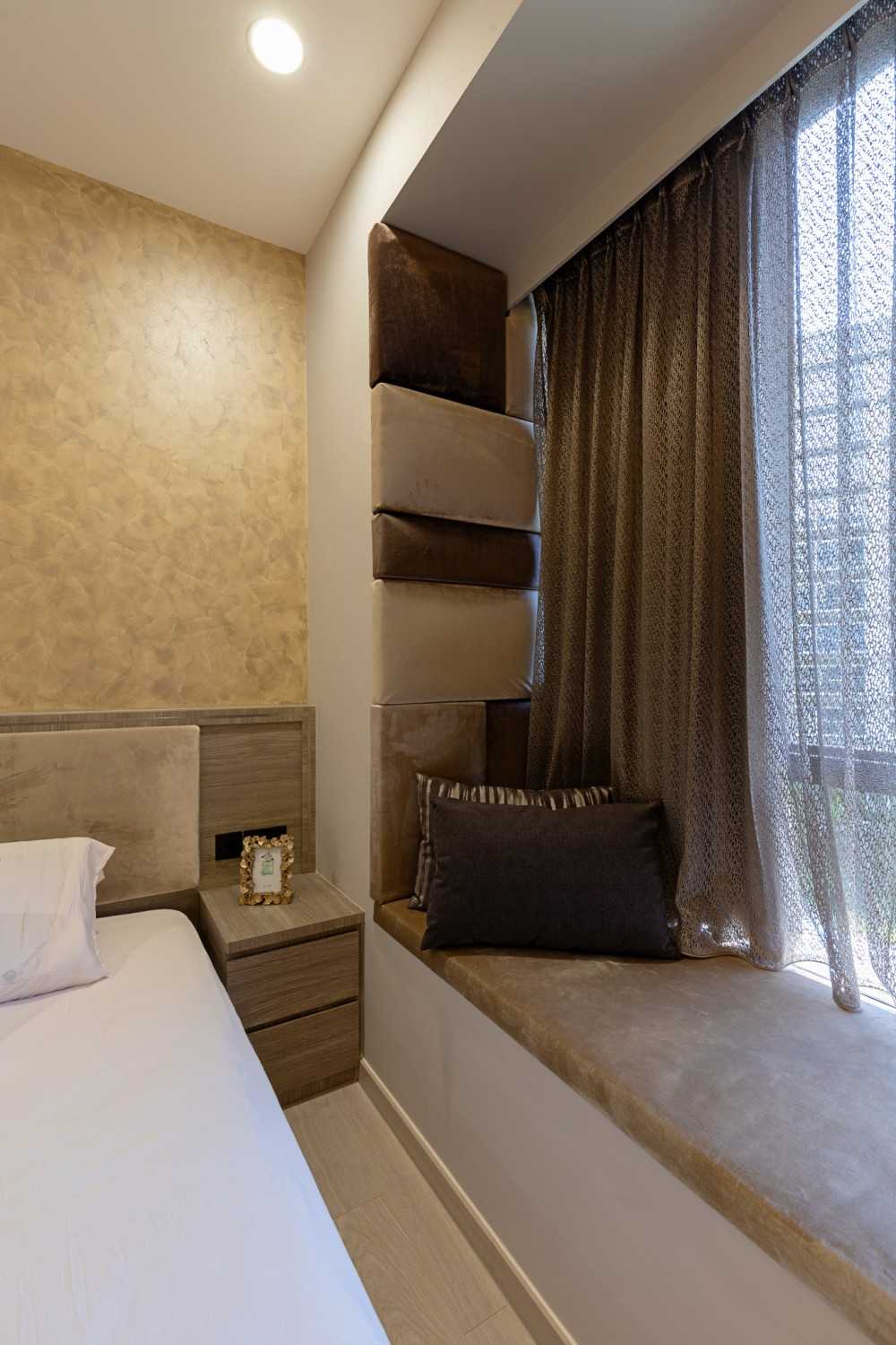 Contemporary Bedroom with Bay Window and Bedside Table