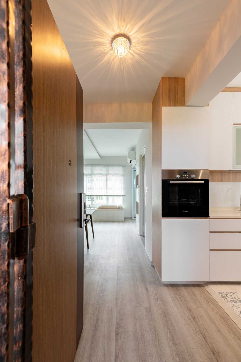 Scandinavian Entryway with Lighting and Doors