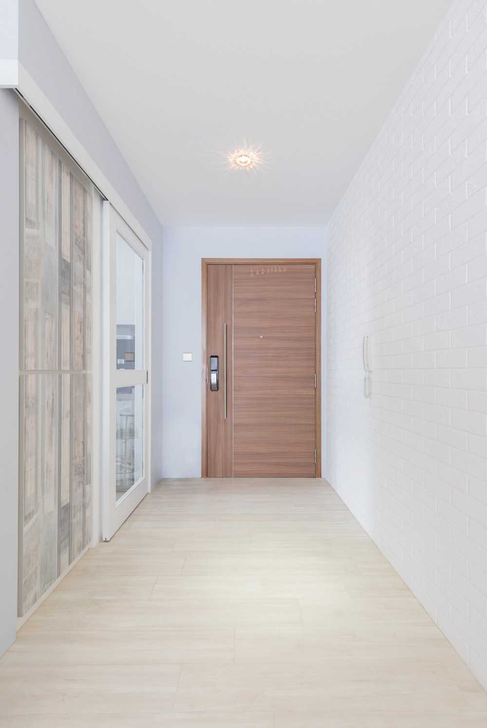 Minimalist Entryway with Doors and Sliding Door