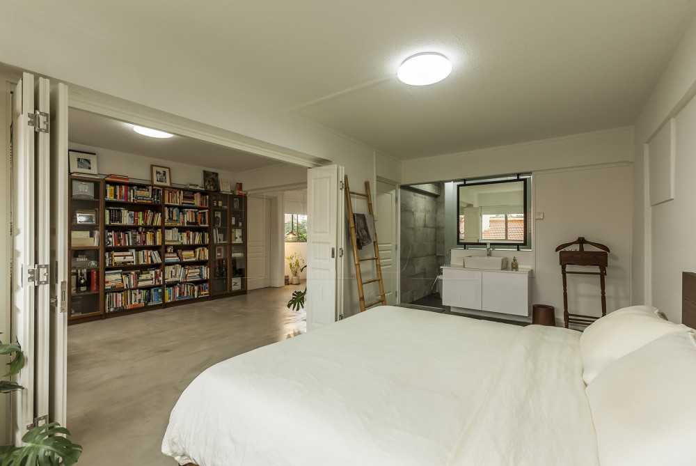 Contemporary Bedroom with Cement Floor and Mirror