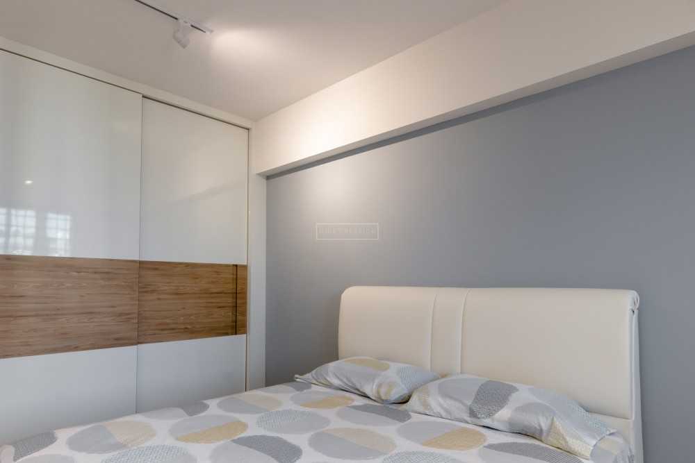 Minimalist Bedroom with Wood Flooring and Wardrobe