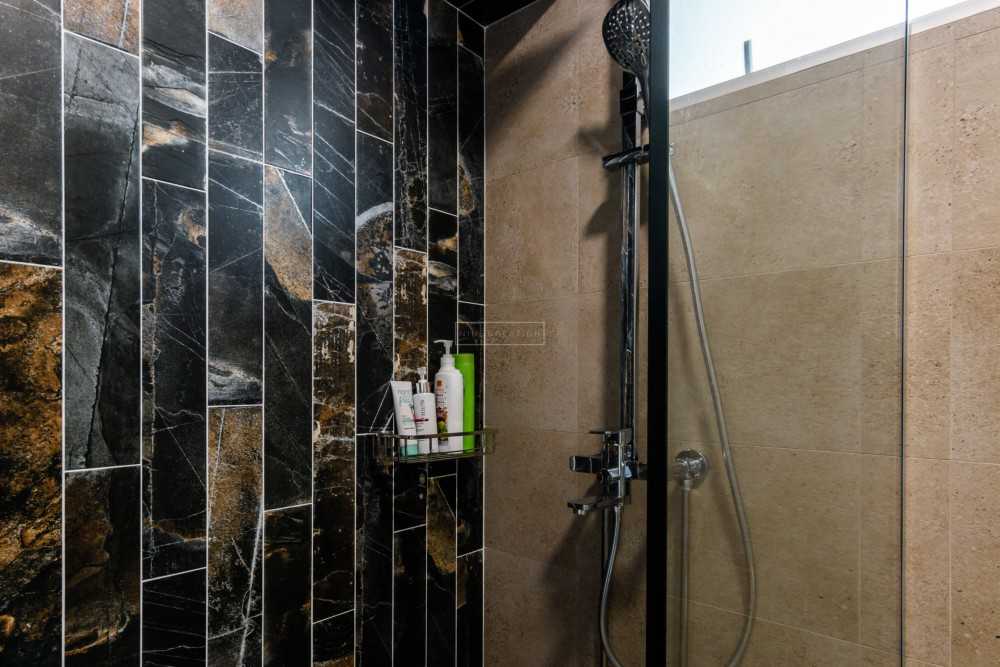 Minimalist Bathroom with Homogeneous Tiles and Shower Screen
