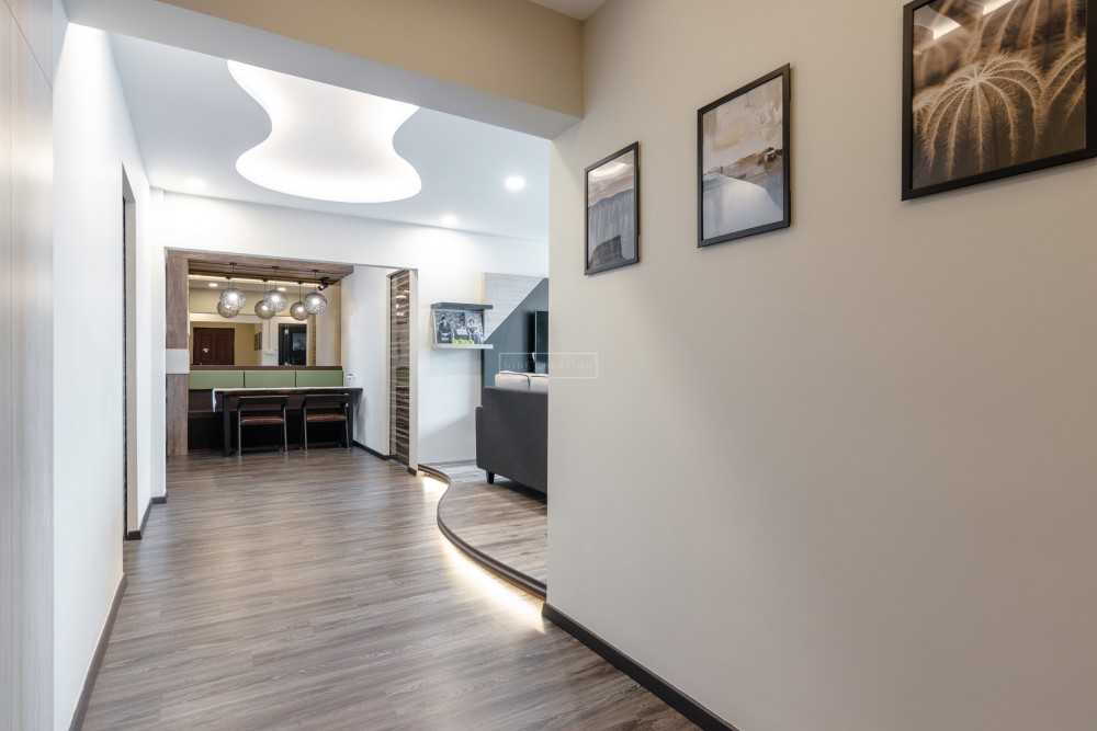 Modern Foyer with Cove Lighting and Artwork