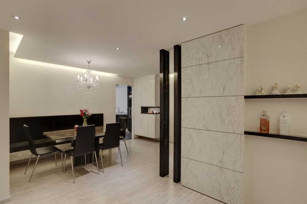 Contemporary Dining Room with Feature Wall and Cove Lighting