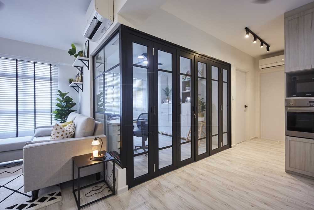 Minimalist Home Office with Bookshelf and Glass Door