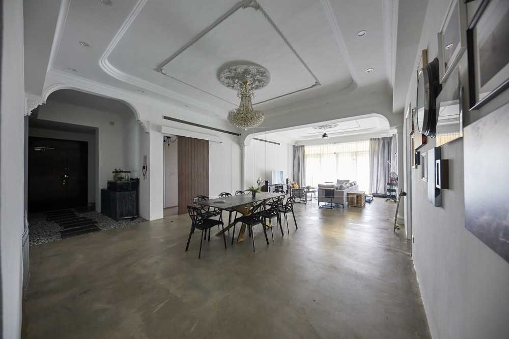 Contemporary Dining Room with Cement Floor and Chandelier