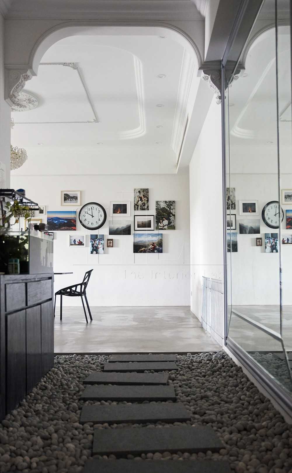 Contemporary Entryway with Granite Floor and Mirror