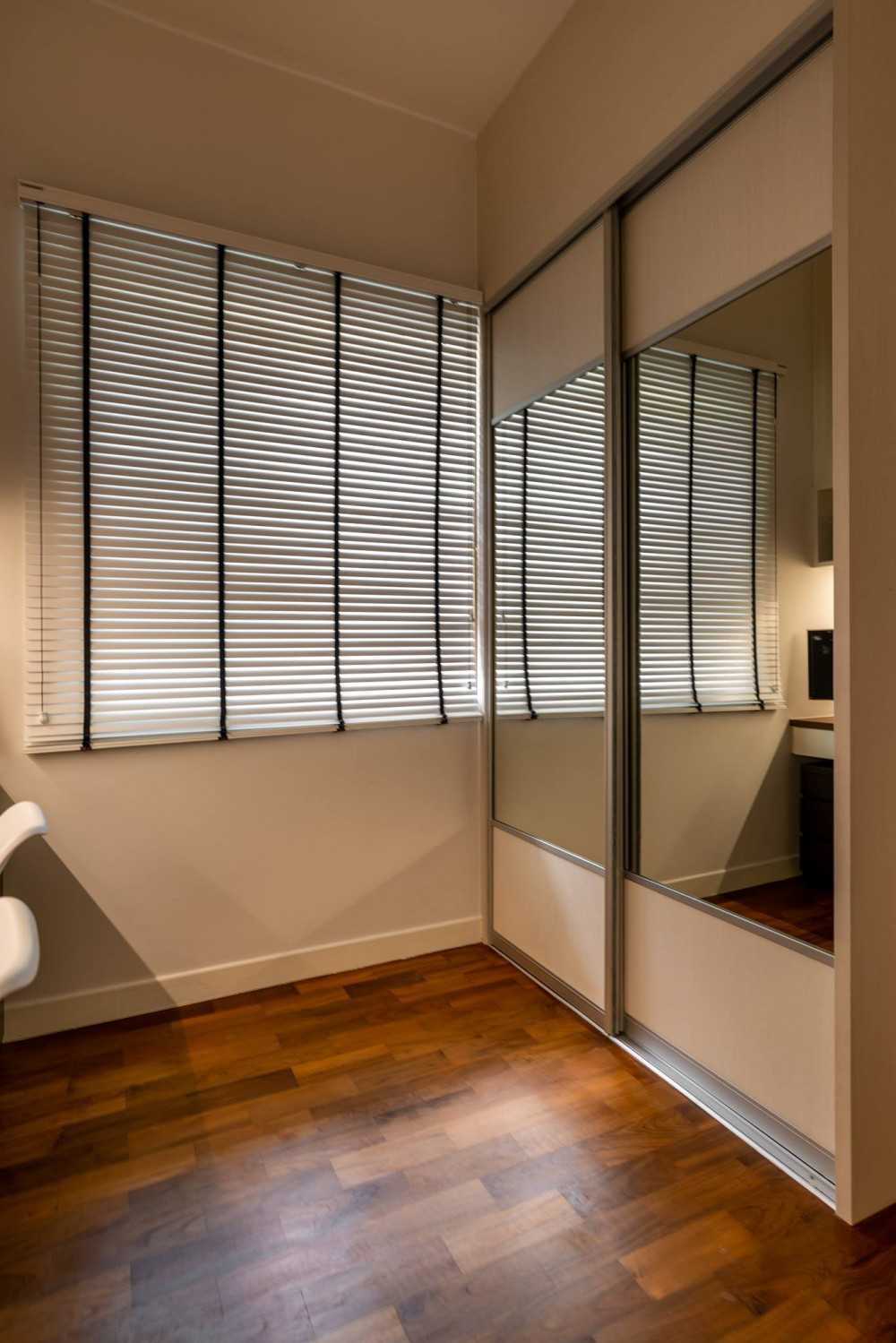 Minimalist Bedroom with Bookshelf and Wardrobe