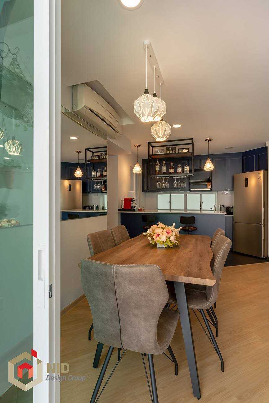 Minimalist Dining Room with Drop Light and Dining Table