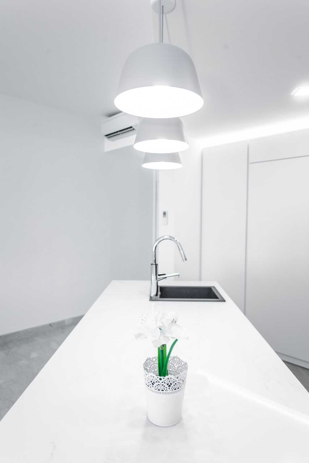 Minimalist Dining Room with Drop Light and Cove Lighting