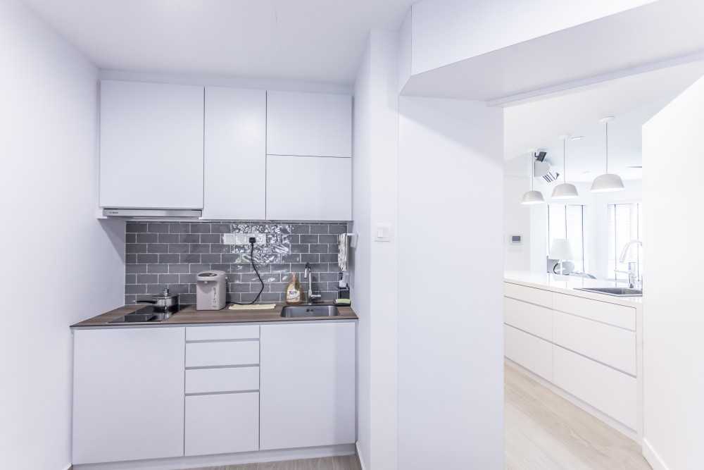 Minimalist Kitchen with Countertop and Wood Flooring