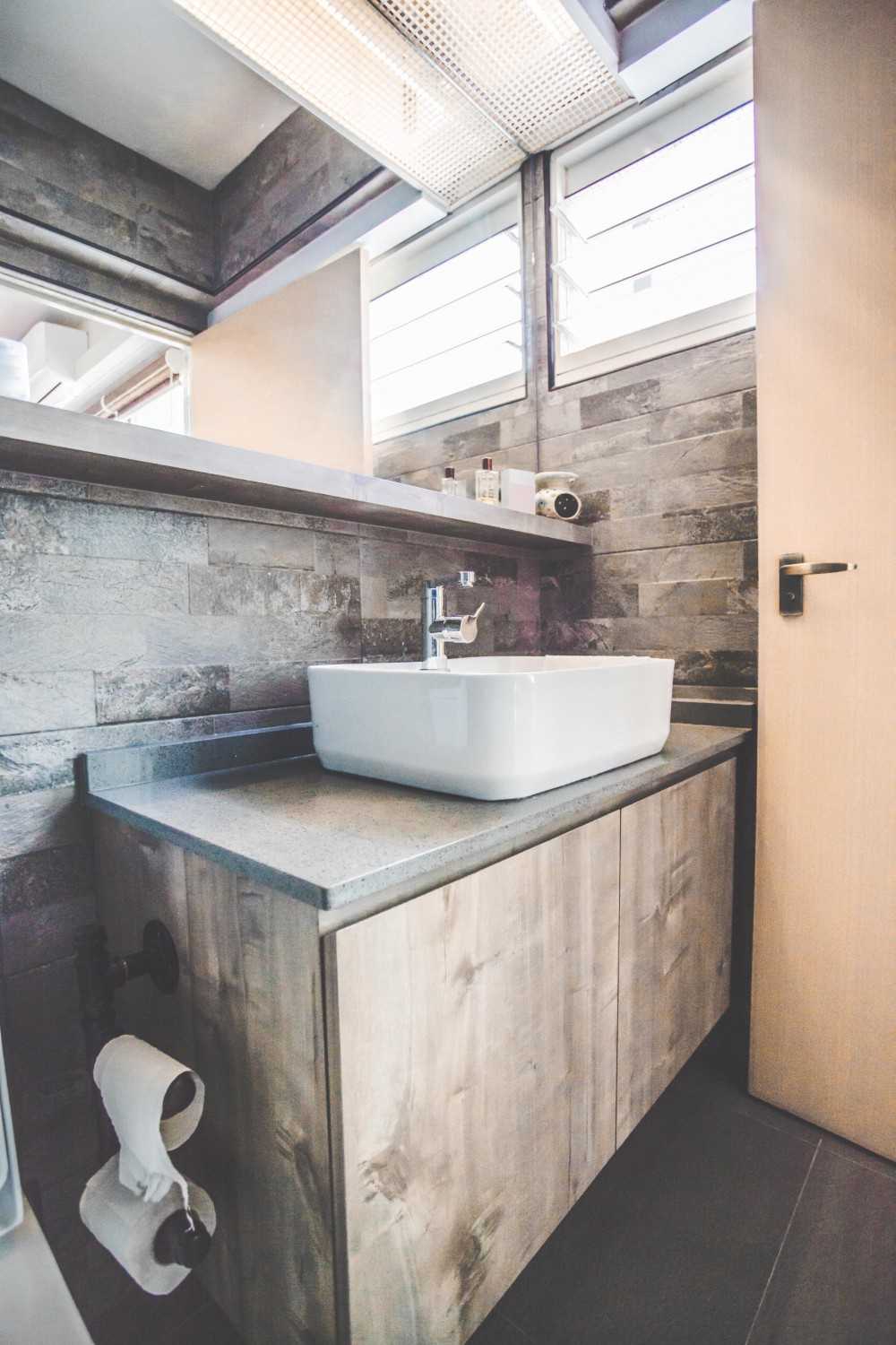 Industrial Bathroom with Countertop and Mirror
