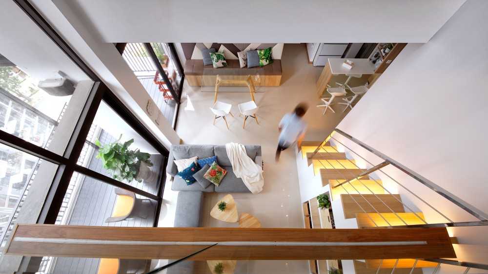 Scandinavian Hallway with Staircase and Sofa