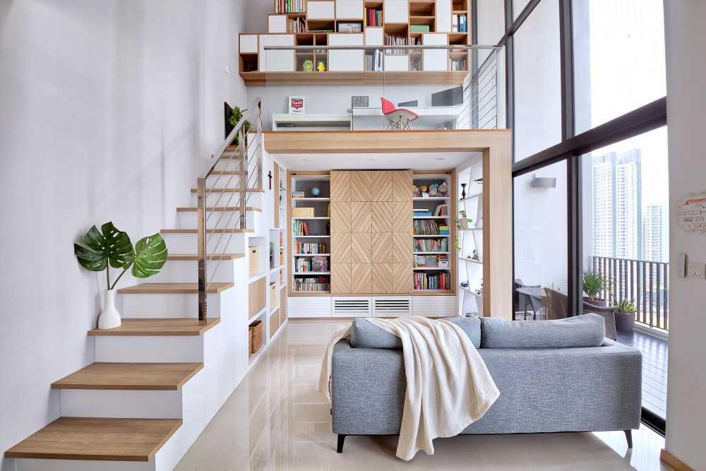 Scandinavian Living Room with Staircase and Sofa