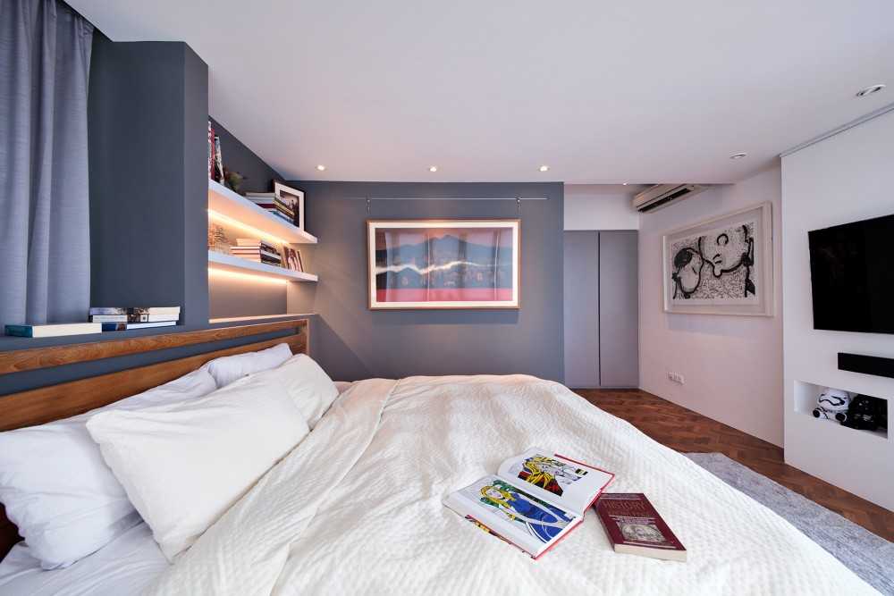 Contemporary Bedroom with Wood Flooring and Paintings