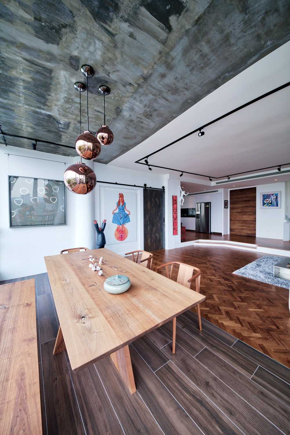 Contemporary Dining Room with Wood Flooring and Drop Light