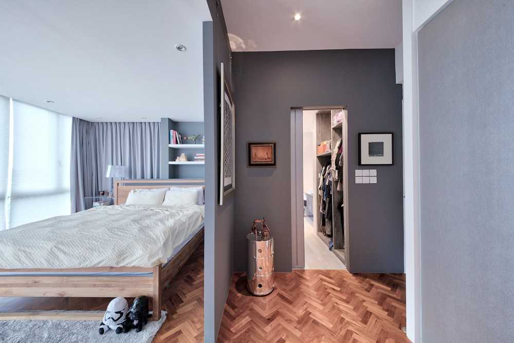 Contemporary Bedroom with Wood Flooring and Paintings