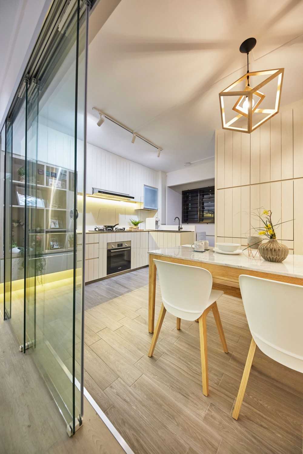 Scandinavian Dining Room with Wood Flooring and Feature Wall