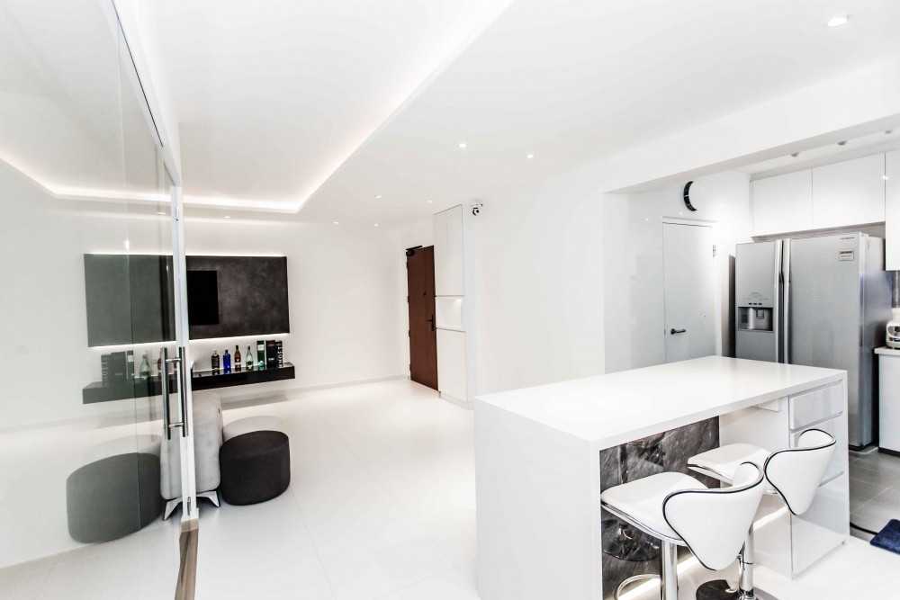 Modern Living Room with Kitchen Island and Cove Lighting