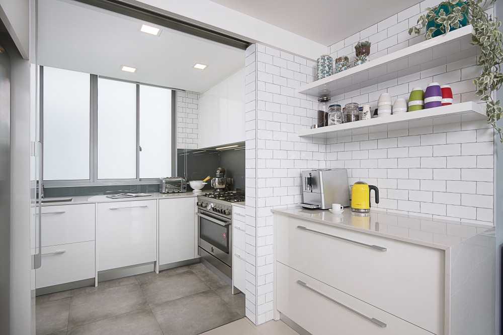 Modern Kitchen with Homogeneous Tiles and Kitchen Window