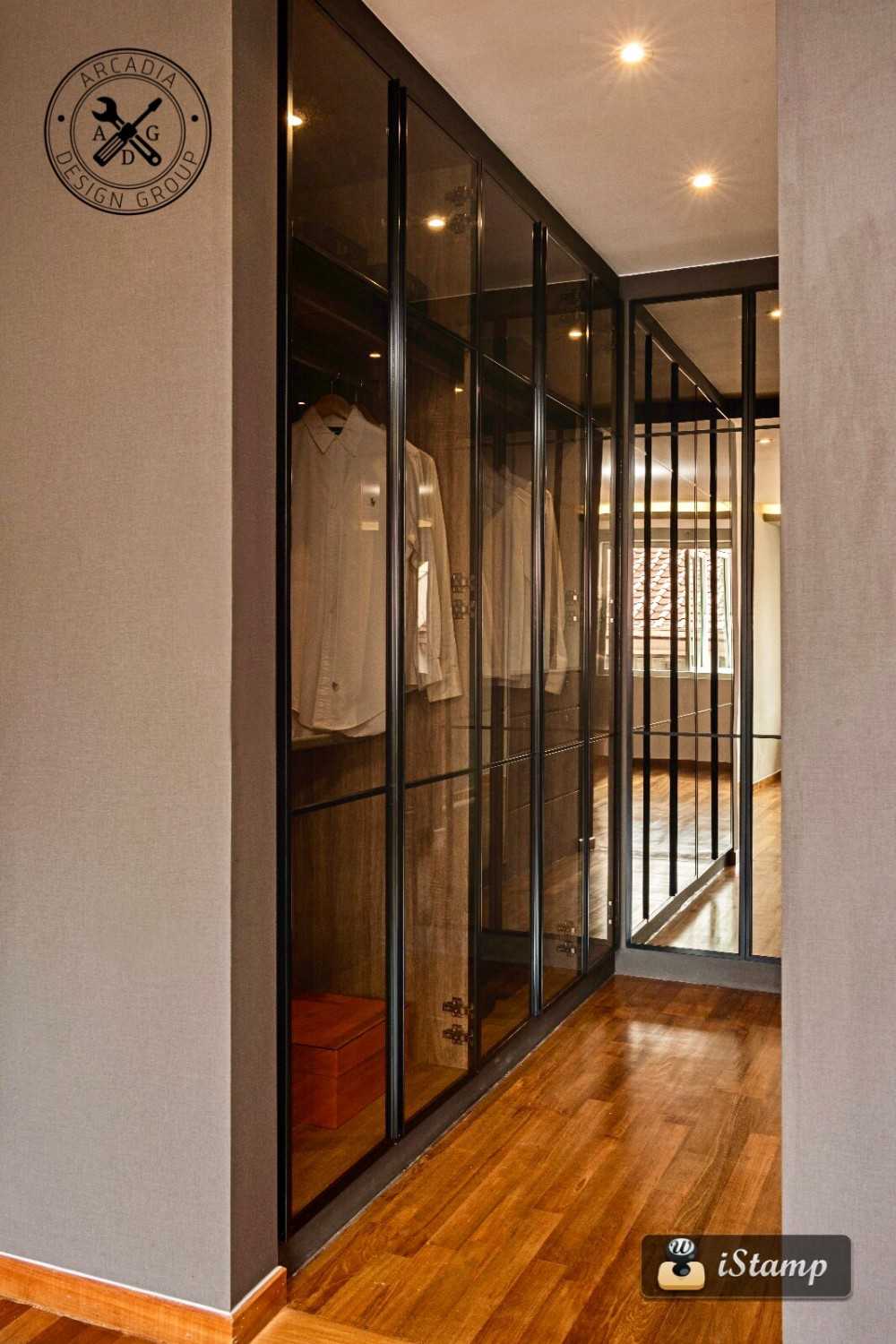 Contemporary Walk-in Wardrobe with Wood Flooring and Glass Door