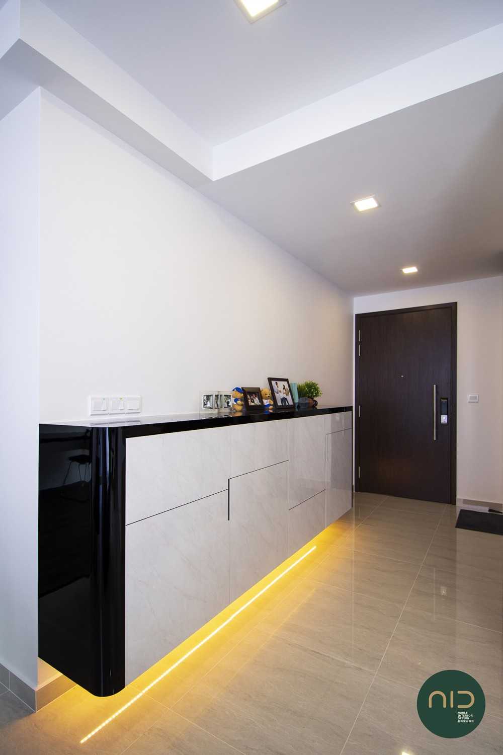 Modern Foyer with Homogeneous Tiles and Cove Lighting