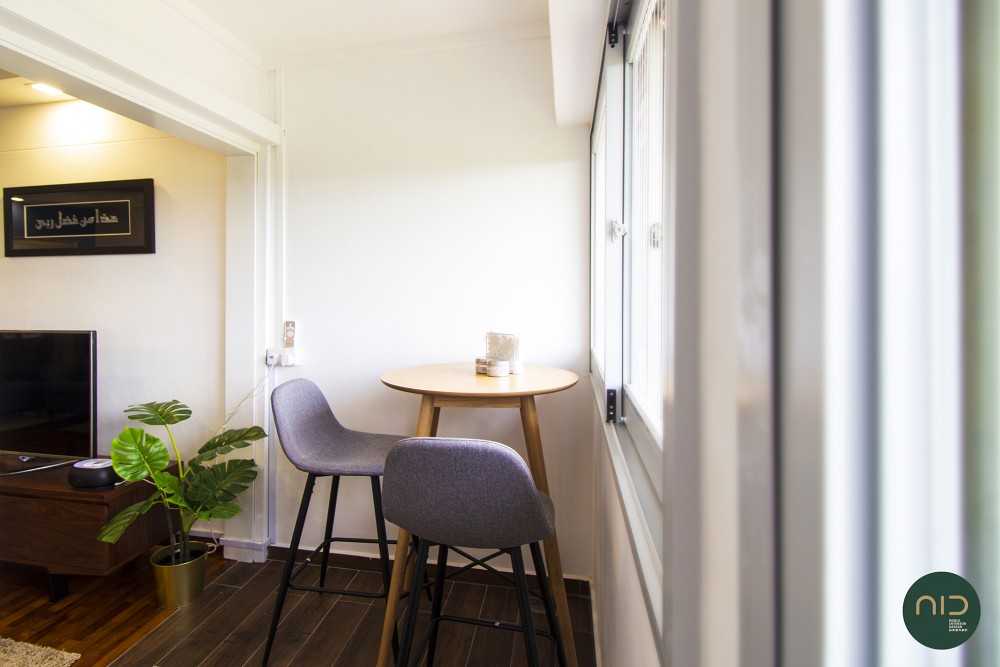 Transitional Balcony with Homogeneous Tiles and Coffee Table