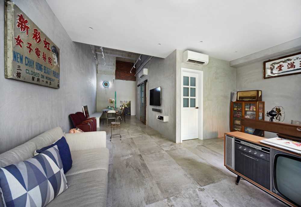 Vintage Living Room with Cement Floor and Sofa