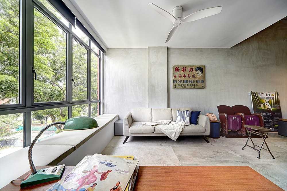 Vintage Living Room with Cement Floor and Bay Window