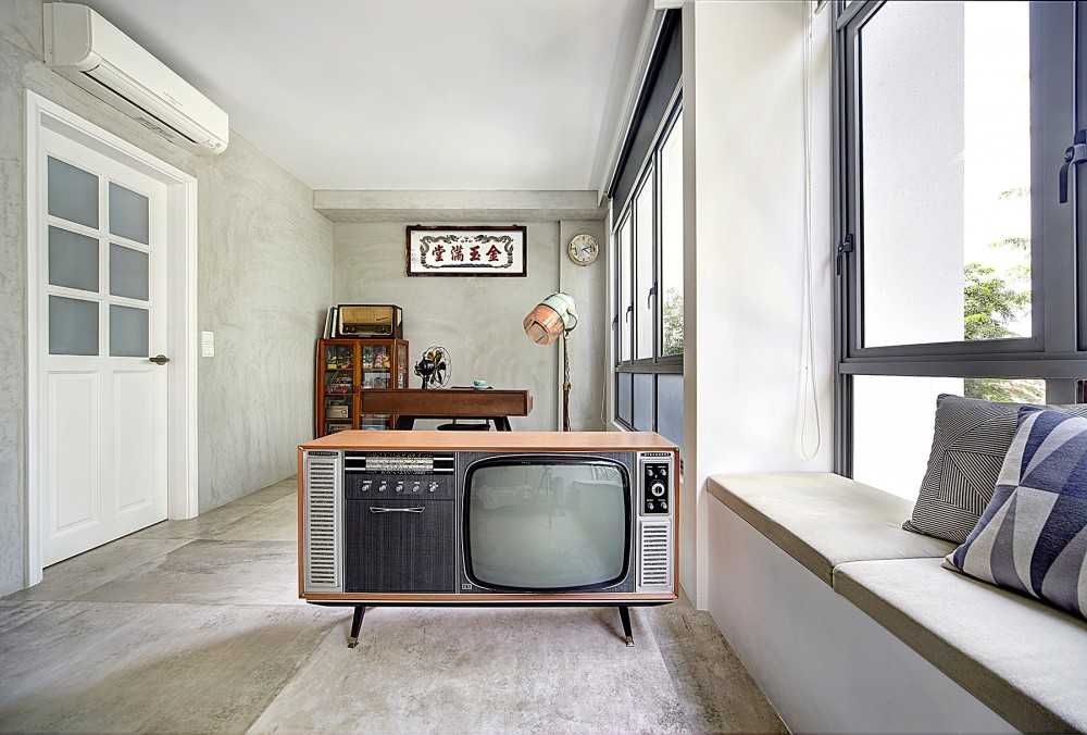 Vintage Living Room with Cement Floor and Bay Window