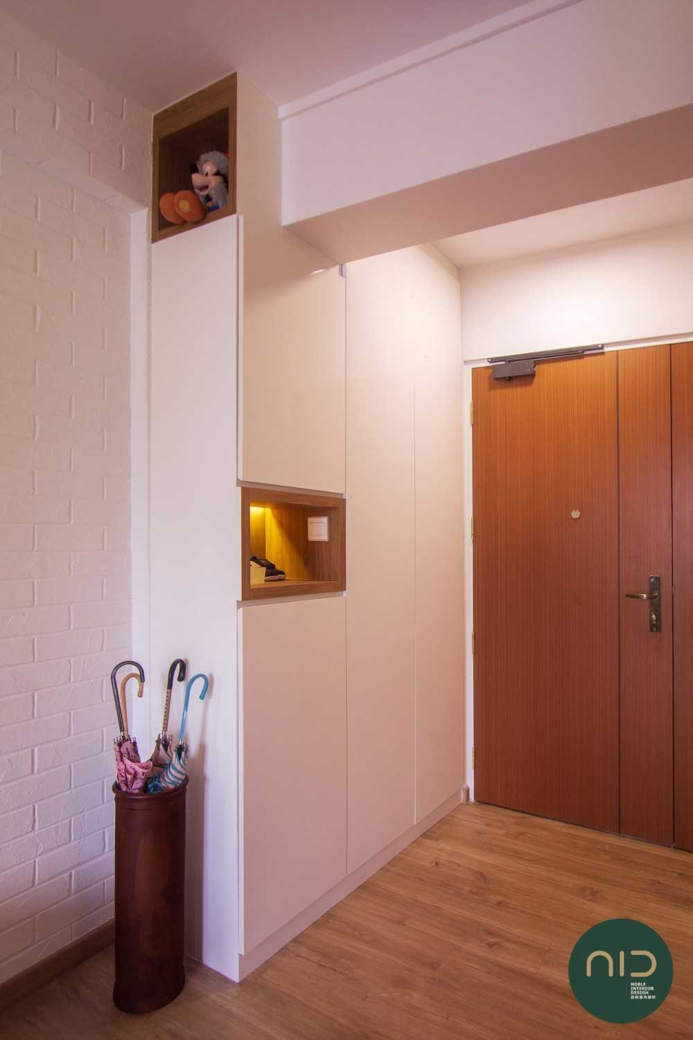Scandinavian Foyer with Feature Wall and Storage Cabinets