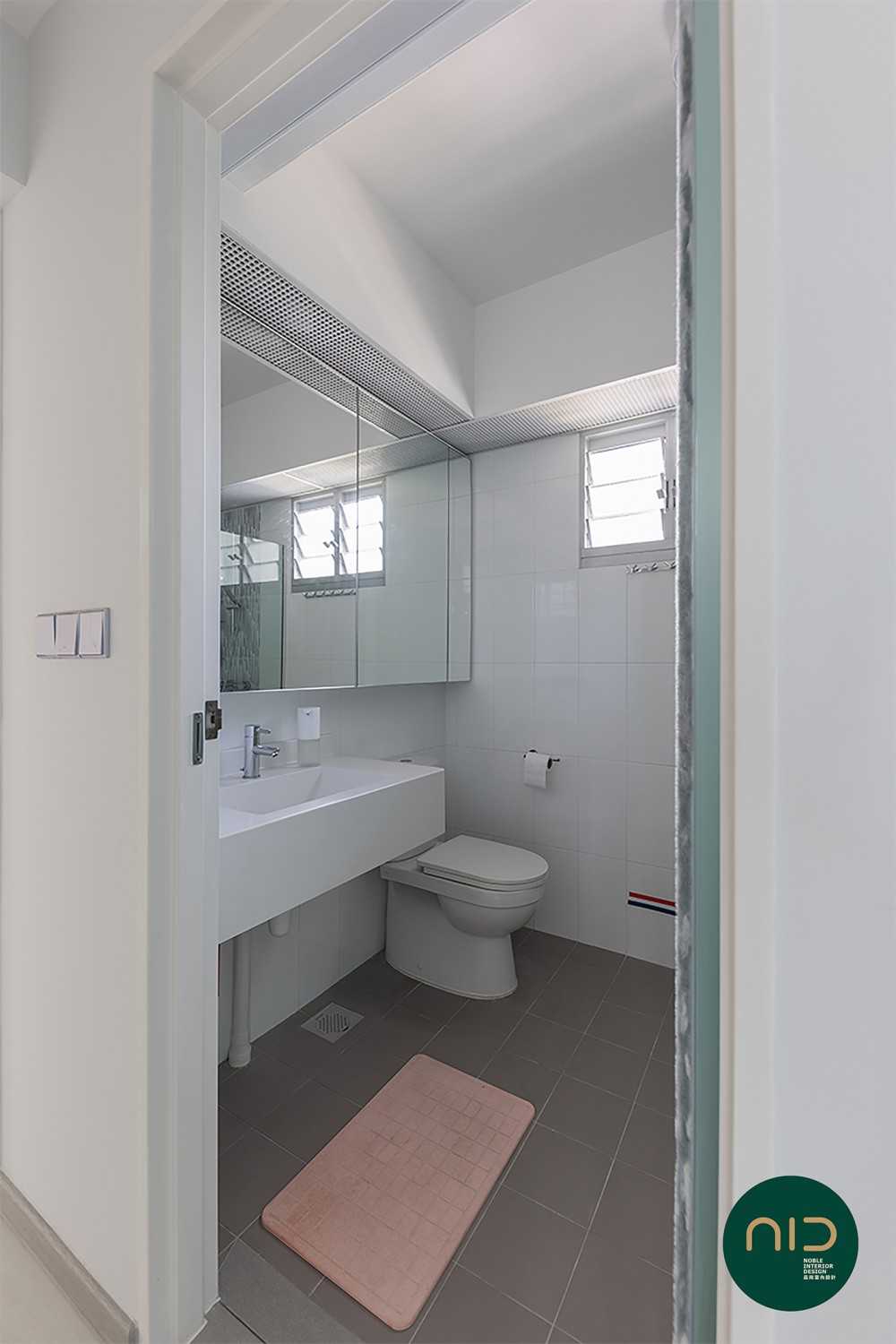 Modern Bathroom with Homogeneous Tiles and Mirror