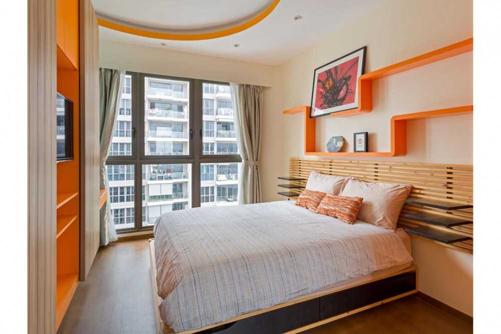 Eclectic Bedroom with TV and Queen Bed
