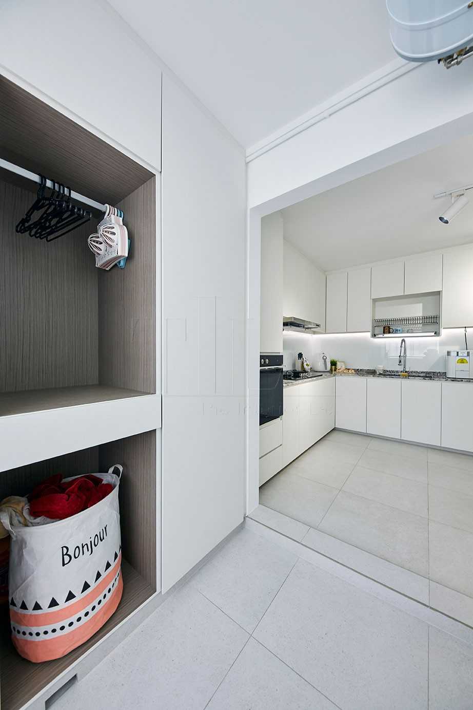 Scandinavian Kitchen with Cove Lighting and Laundry Area