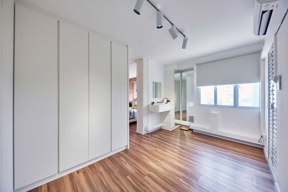 Scandinavian Walk-in Wardrobe with Wood Flooring and Mirror