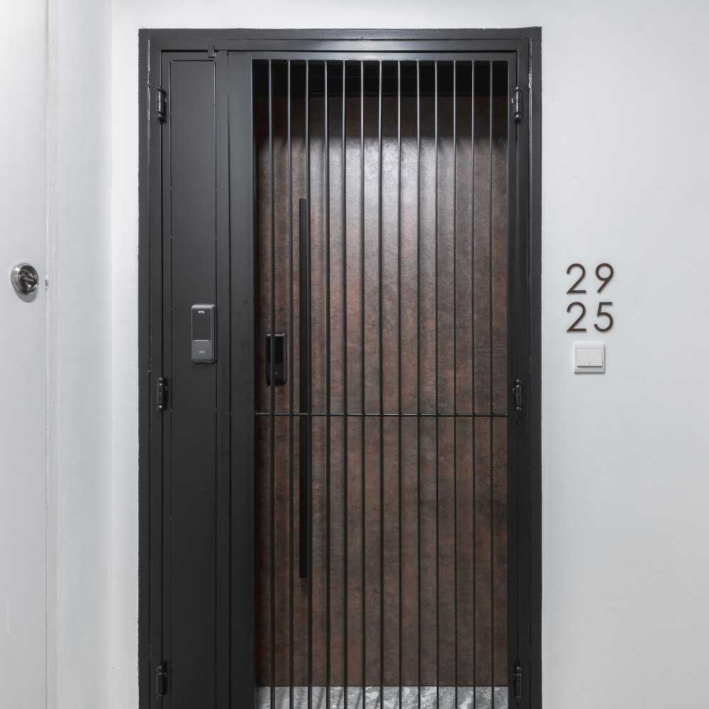 Contemporary Entryway with Metal Gate and Doors