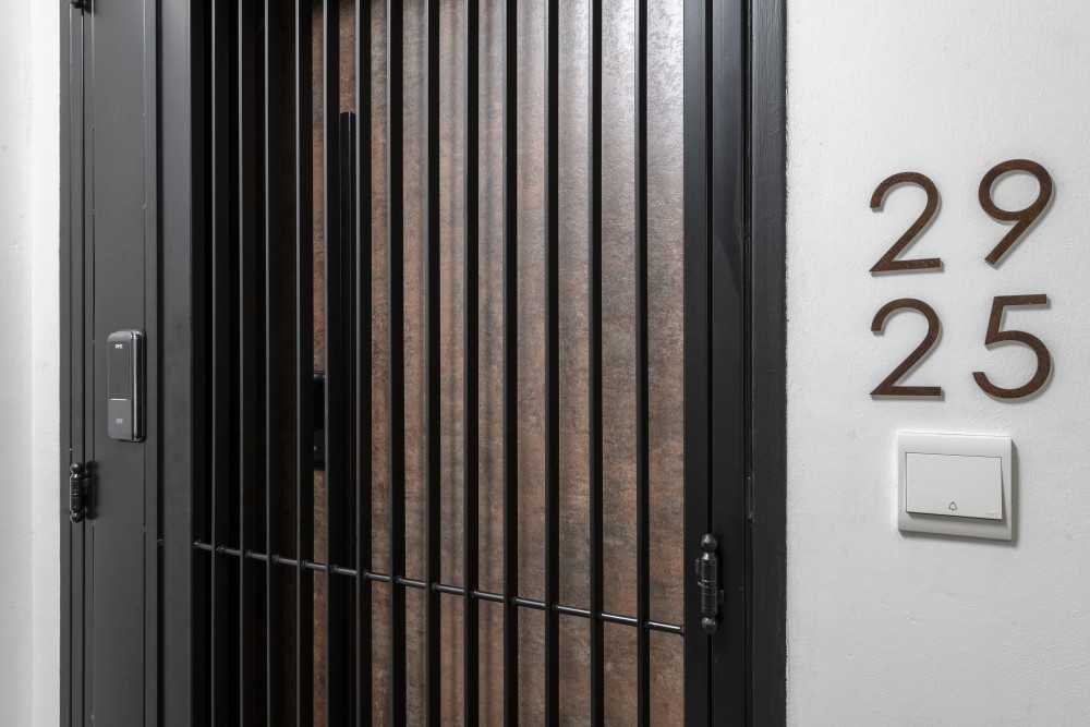 Contemporary Entryway with Metal Gate and Doors