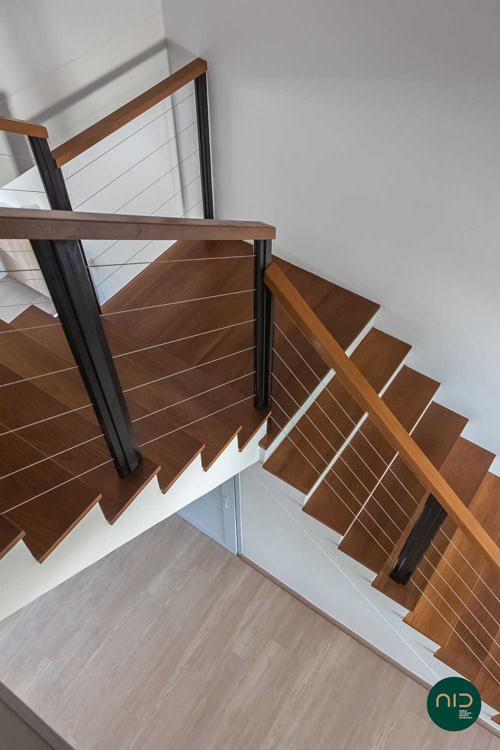 Modern Hallway with Wood Flooring and Paintings